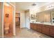 Spacious bathroom with dual sinks, generous counter space, and ample storage at 2211 W Desert Ln, Phoenix, AZ 85041