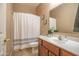 Bathroom featuring a vanity, shower with a curtain, and framed art at 2211 W Desert Ln, Phoenix, AZ 85041