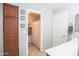 Bathroom featuring a wooden cabinet, a shower with curtain, and grey walls at 2211 W Desert Ln, Phoenix, AZ 85041