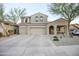 Charming two-story home with a three-car garage and desert landscaping at 2211 W Desert Ln, Phoenix, AZ 85041