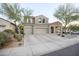 Lovely two-story home with a three-car garage, arched entryway, and low-maintenance desert landscaping for easy care at 2211 W Desert Ln, Phoenix, AZ 85041