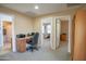 Home office featuring a desk and chair in an open and naturally lit space at 2211 W Desert Ln, Phoenix, AZ 85041