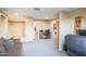 Spacious living room with neutral tones, plush carpeting, and a cozy seating area at 2211 W Desert Ln, Phoenix, AZ 85041