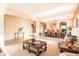 Spacious living room with a large dining table, a stairwell, and carpet floors at 2211 W Desert Ln, Phoenix, AZ 85041