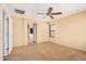 Inviting bedroom with carpet flooring, ceiling fan, and a neutral color scheme at 22123 E Vía Del Palo --, Queen Creek, AZ 85142