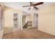 This bonus room leads to a staircase and the laundry room; features neutral carpet at 22123 E Vía Del Palo --, Queen Creek, AZ 85142