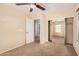 This bedroom features a mirrored closet, neutral carpet, and access to an ensuite bathroom at 22123 E Vía Del Palo --, Queen Creek, AZ 85142
