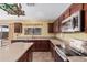 Well-equipped kitchen with stainless steel appliances, tile backsplash, and plenty of counter space at 22123 E Vía Del Palo --, Queen Creek, AZ 85142
