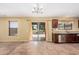 Open kitchen with modern stainless steel appliances, tile flooring, sliding glass doors, and backyard views at 22123 E Vía Del Palo --, Queen Creek, AZ 85142