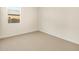 Neutral carpeted bedroom with simple design at 22490 W Tonopah Dr, Surprise, AZ 85387
