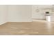 Bright living room featuring tile floors and seamlessly connected with a modern, white kitchen at 22490 W Tonopah Dr, Surprise, AZ 85387