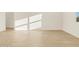 Well-lit living room featuring tile floors and lots of natural light at 22490 W Tonopah Dr, Surprise, AZ 85387