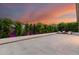 Expansive backyard features a stylish patio with greenery, hedges, and privacy landscaping at 22609 E Roundup Way, Queen Creek, AZ 85142