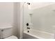 Clean bathroom featuring a tiled shower-tub combo and modern black fixtures at 22609 E Roundup Way, Queen Creek, AZ 85142