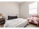 Comfortable bedroom with a plush bed and cozy decor at 22609 E Roundup Way, Queen Creek, AZ 85142