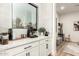 Stylish coffee bar with white cabinets, black hardware and countertop appliances, conveniently located next to a sunny window at 22609 E Roundup Way, Queen Creek, AZ 85142