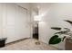 Bright hallway featuring natural light and a view of a bathroom at 22609 E Roundup Way, Queen Creek, AZ 85142