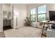 Home office with natural light, modern decor, and an ensuite bathroom at 22609 E Roundup Way, Queen Creek, AZ 85142