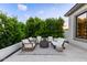 Charming backyard patio featuring a fire pit, comfortable seating, and manicured landscaping at 22609 E Roundup Way, Queen Creek, AZ 85142