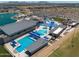 Aerial view of water park featuring pools, slides, and recreational swimming areas for Gathering fun at 22609 E Roundup Way, Queen Creek, AZ 85142
