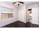 Cozy bedroom with a ceiling fan, closet, and window at 2310 W Sienna Bouquet Pl, Phoenix, AZ 85085