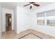 Bright, neutral bedroom featuring a ceiling fan, and closet at 2310 W Sienna Bouquet Pl, Phoenix, AZ 85085