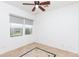 Bedroom with neutral walls, tile floors, and views of landscaping at 2310 W Sienna Bouquet Pl, Phoenix, AZ 85085