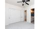 Bright bedroom with a ceiling fan and closet at 2310 W Sienna Bouquet Pl, Phoenix, AZ 85085