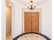 Elegant foyer features a decorative tile floor and a grand chandelier, creating a welcoming entrance at 2310 W Sienna Bouquet Pl, Phoenix, AZ 85085