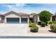 Charming home boasts a well-manicured front yard, complemented by a spacious three-car garage at 2310 W Sienna Bouquet Pl, Phoenix, AZ 85085