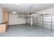 Spacious garage featuring built-in cabinets for extra storage and insulated garage doors at 2310 W Sienna Bouquet Pl, Phoenix, AZ 85085