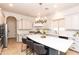 Open kitchen featuring an expansive island with seating and gourmet appliances at 2310 W Sienna Bouquet Pl, Phoenix, AZ 85085