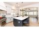 Bright kitchen with stainless steel appliances, island seating, and ample counter space at 2310 W Sienna Bouquet Pl, Phoenix, AZ 85085