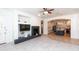 Stylish living room features a modern fireplace, built-in shelving, and an open view to the kitchen at 2310 W Sienna Bouquet Pl, Phoenix, AZ 85085