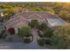 Expansive single Gathering house with a red tile roof, desert landscaping, mountain views, and outdoor seating at 24158 N 78Th Pl, Scottsdale, AZ 85255