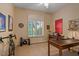 Bright bedroom featuring a large desk, window with shutters and bike-themed decor at 24158 N 78Th Pl, Scottsdale, AZ 85255