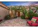 Home's entrance features desert landscaping, tiled walkway, and an outdoor seating area at 24158 N 78Th Pl, Scottsdale, AZ 85255