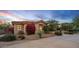 Desert home displaying attractive landscaping, a cozy ambiance with warm lighting under the evening sky at 24158 N 78Th Pl, Scottsdale, AZ 85255