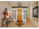 Inviting foyer featuring tile floors, decorative table, and beautiful natural light at 24158 N 78Th Pl, Scottsdale, AZ 85255