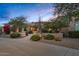 Inviting single-Gathering home showcasing desert landscaping and a warm, tranquil ambiance under the evening sky at 24158 N 78Th Pl, Scottsdale, AZ 85255