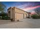 Three-car garage with extended driveway and well-maintained desert landscaping at 24158 N 78Th Pl, Scottsdale, AZ 85255