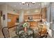 Spacious kitchen with a breakfast nook, stone countertops, and modern stainless steel appliances at 24158 N 78Th Pl, Scottsdale, AZ 85255