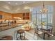 Bright kitchen featuring stone countertops, stainless appliances, and a breakfast nook bathed in sunlight at 24158 N 78Th Pl, Scottsdale, AZ 85255