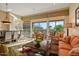 Bright and airy living room with tile floors, cozy sofas, dining area, and ample natural light at 24158 N 78Th Pl, Scottsdale, AZ 85255