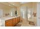 Bathroom featuring a walk-in shower, spacious vanity, and lots of natural light at 24158 N 78Th Pl, Scottsdale, AZ 85255