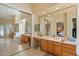 Beautiful main bathroom with double vanity and large mirrors at 24158 N 78Th Pl, Scottsdale, AZ 85255