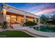Lounge chairs and desert landscaping surrounding freeform pool offer the ultimate relaxation experience at 24158 N 78Th Pl, Scottsdale, AZ 85255