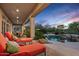 Covered patio overlooks freeform pool area with lounge chairs and natural desert landscaping at 24158 N 78Th Pl, Scottsdale, AZ 85255