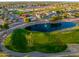Beautiful aerial shot overlooking the golf course, a pond, mature landscaping, and surrounding neighborhood at 2503 E Camellia Dr, Gilbert, AZ 85296