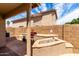 Outdoor kitchen with a built-in grill and bar area, perfect for outdoor gatherings and dining at 2503 E Camellia Dr, Gilbert, AZ 85296